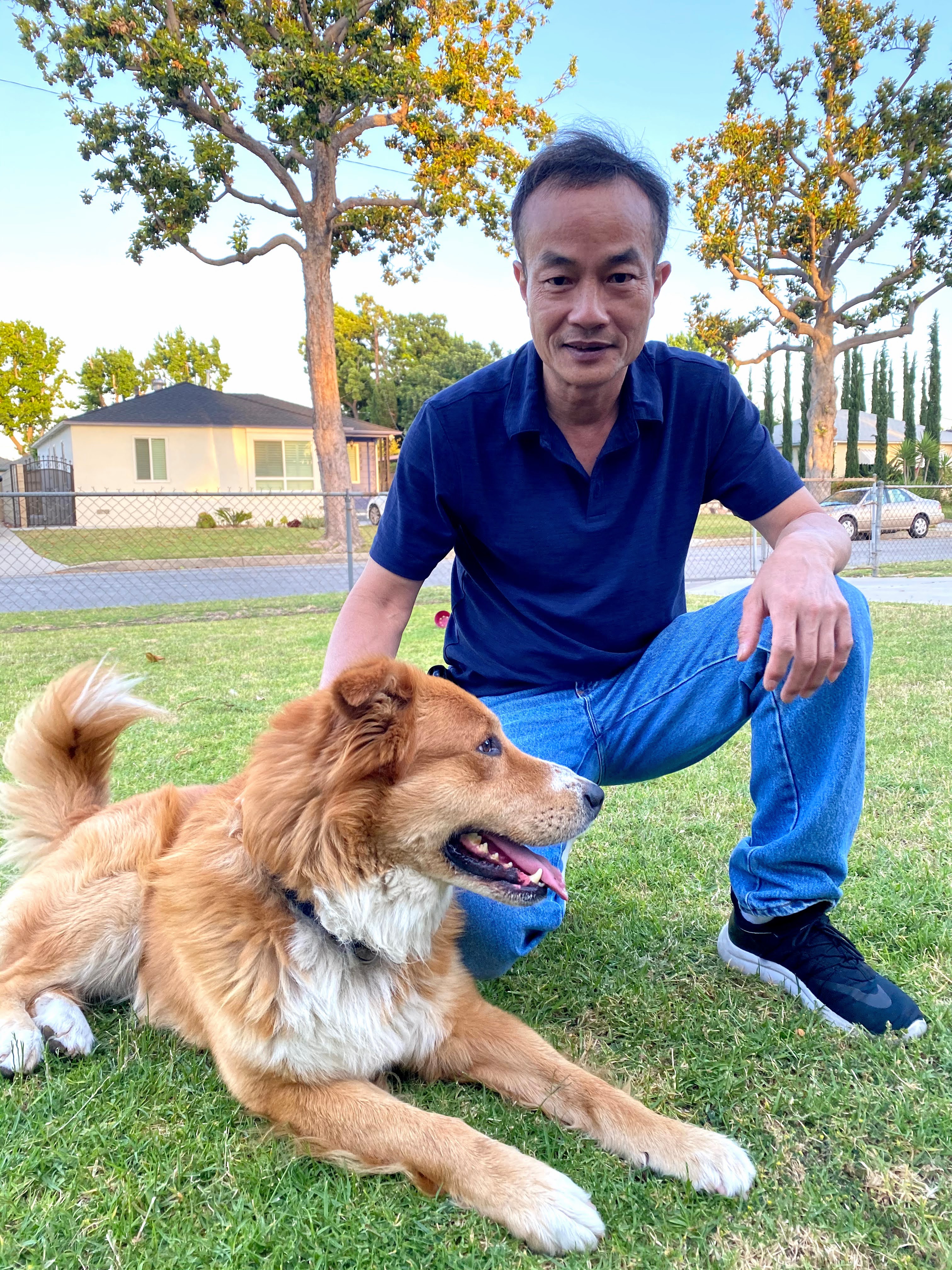 Boba and my dad posing on our front lawn.